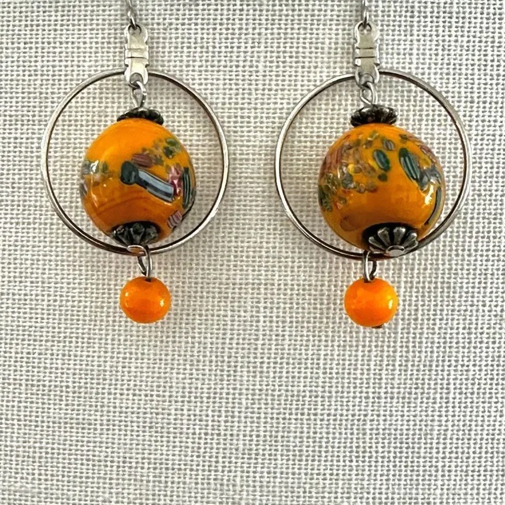 Silver tone orange beaded drop earrings